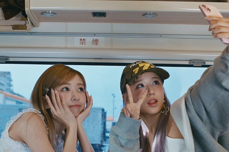 2 members of Limelight are posing cutely for a selfie in an RV