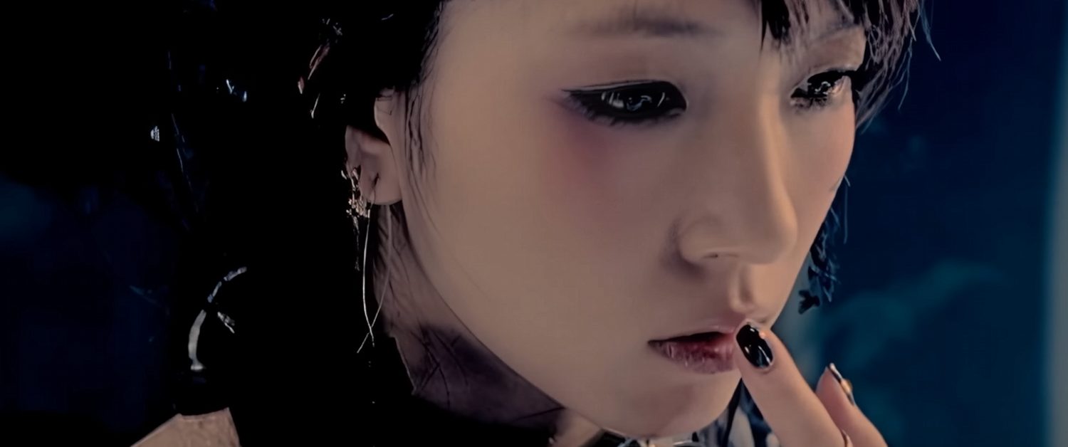 K-Pop singer Boa is pressing a finger to her lips