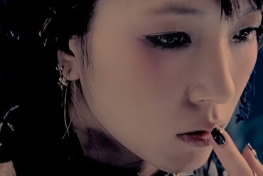 K-Pop singer Boa is pressing a finger to her lips